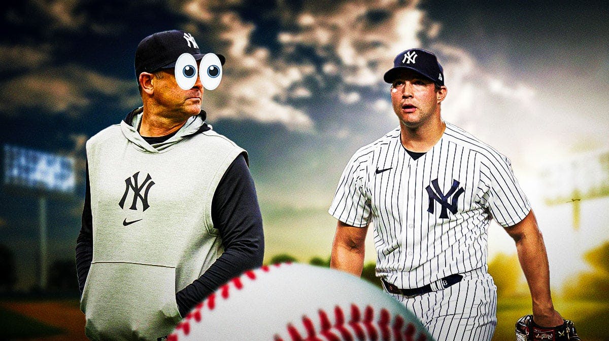 Aaron Boone with big emoji eyes looking at Tommy Kahnle