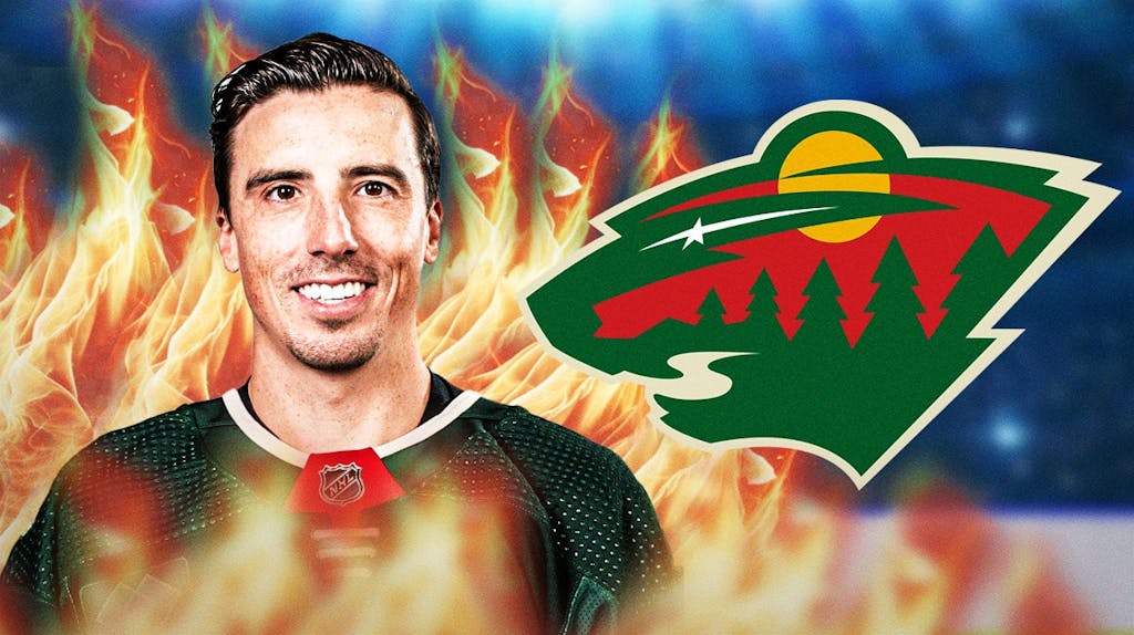 Marc-Andre Fleury with fire around him looking happy, Minnesota Wild logo, hockey rink in background