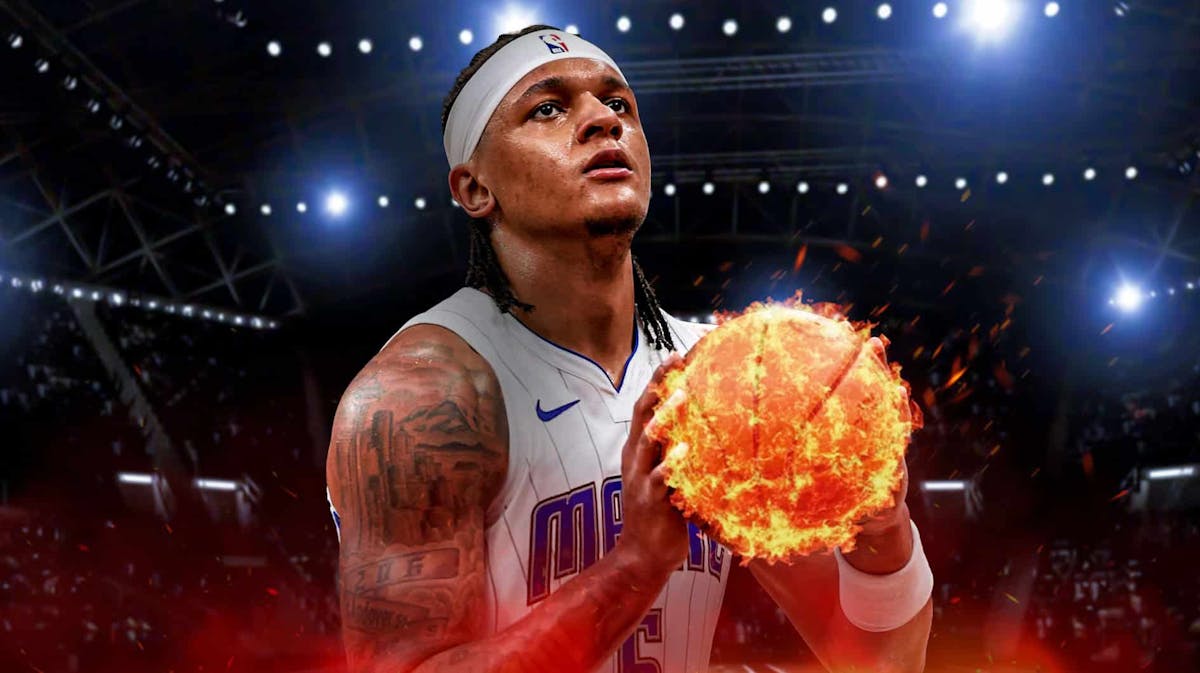 Magic forward Paolo Banchero, with a basketball that is on fire.