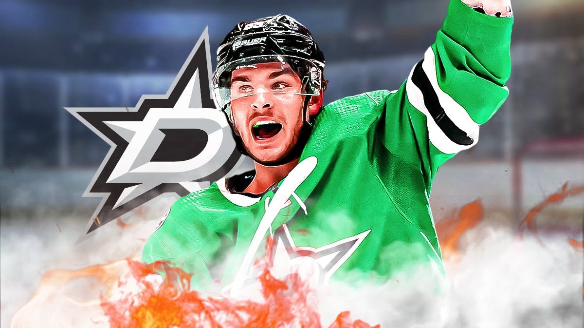 Wyatt Johnston in middle of image looking happy with fire around him, Dallas Stars logo, hockey rink in background