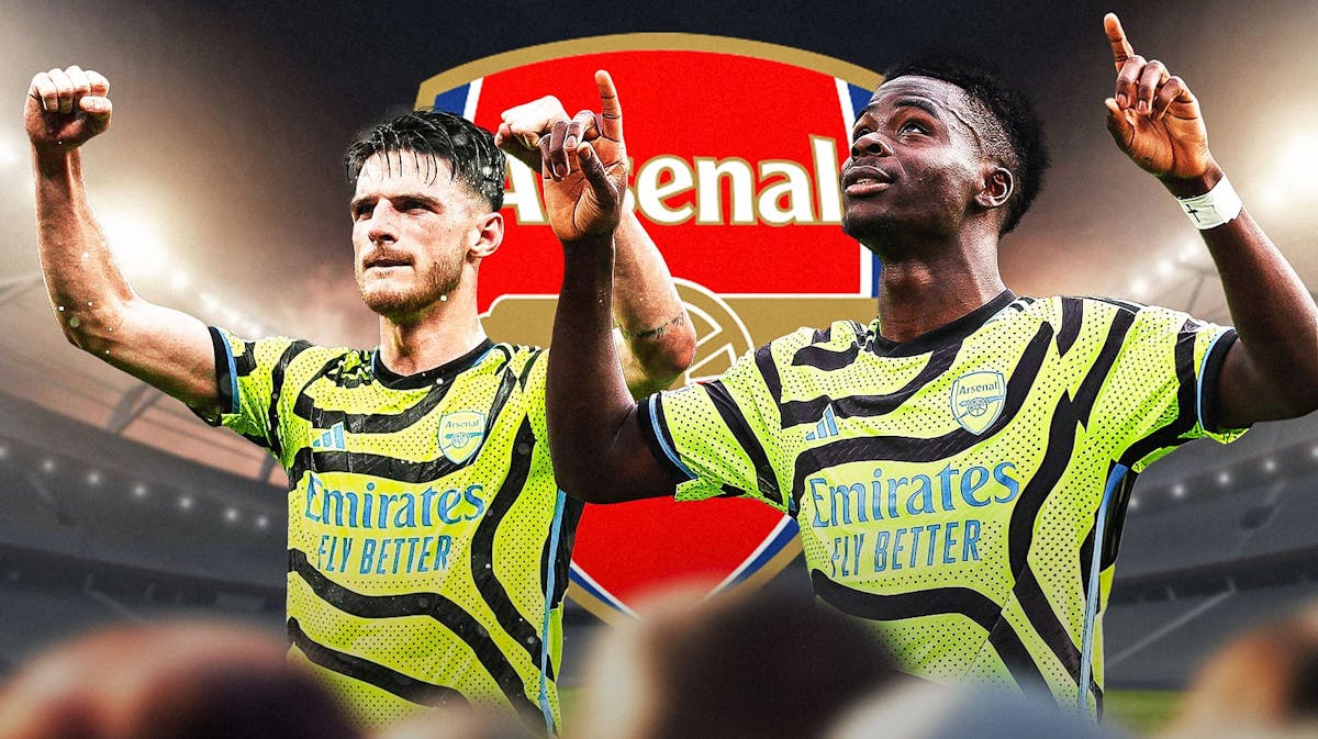 Declan Rice, Bukayo Saka celebrating in front of the Arsenal logo