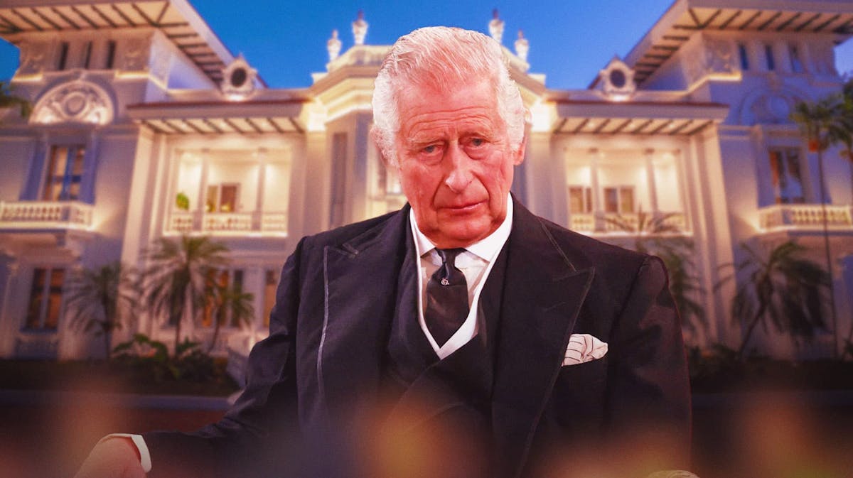 King Charles III with a mansion behind him
