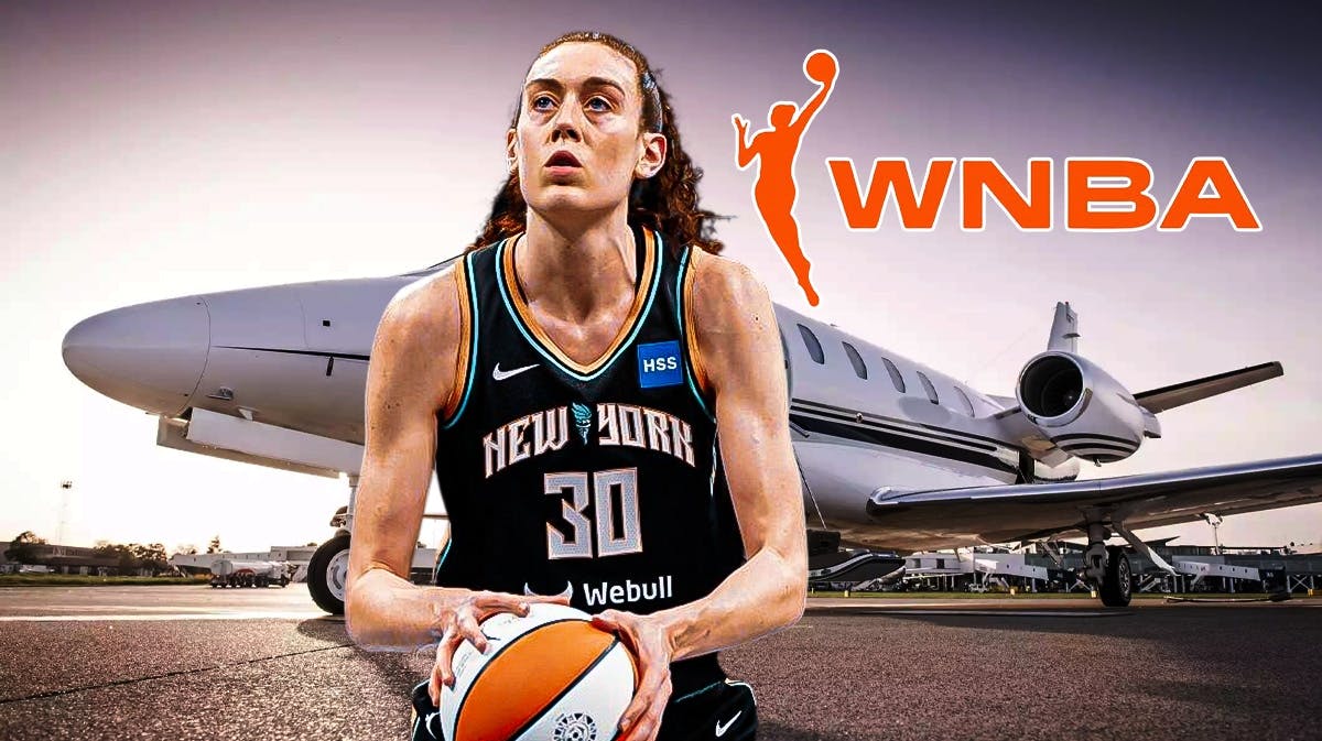 New York Liberty star Breanna Stewart stand next to charter flight plane, WNBA logo