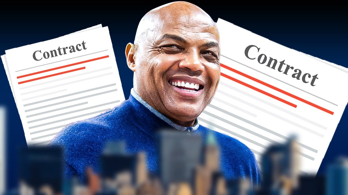 Charles Barkley with contracts in the background