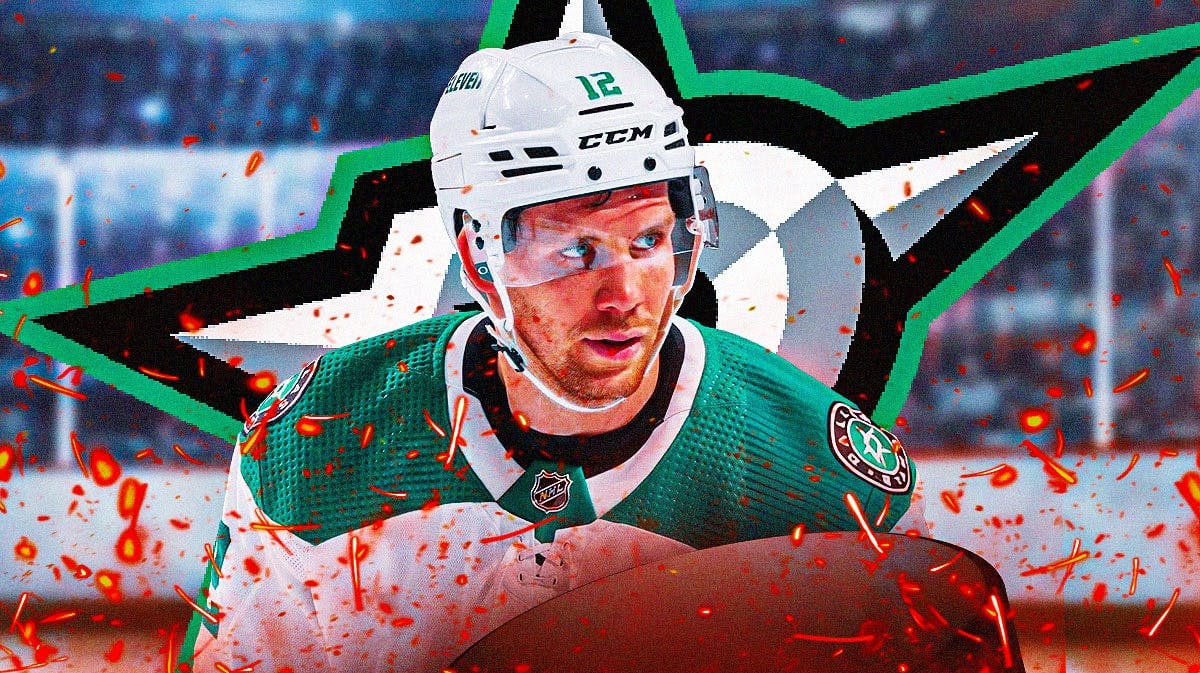 Radek Faksa in middle of image looking happy with fire around him, Dallas Stars logo, hockey rink in background