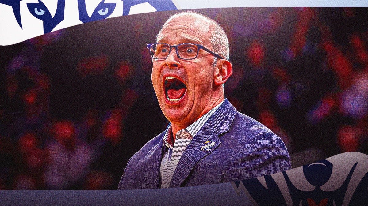 Dan Hurley with the UConn logo in the background