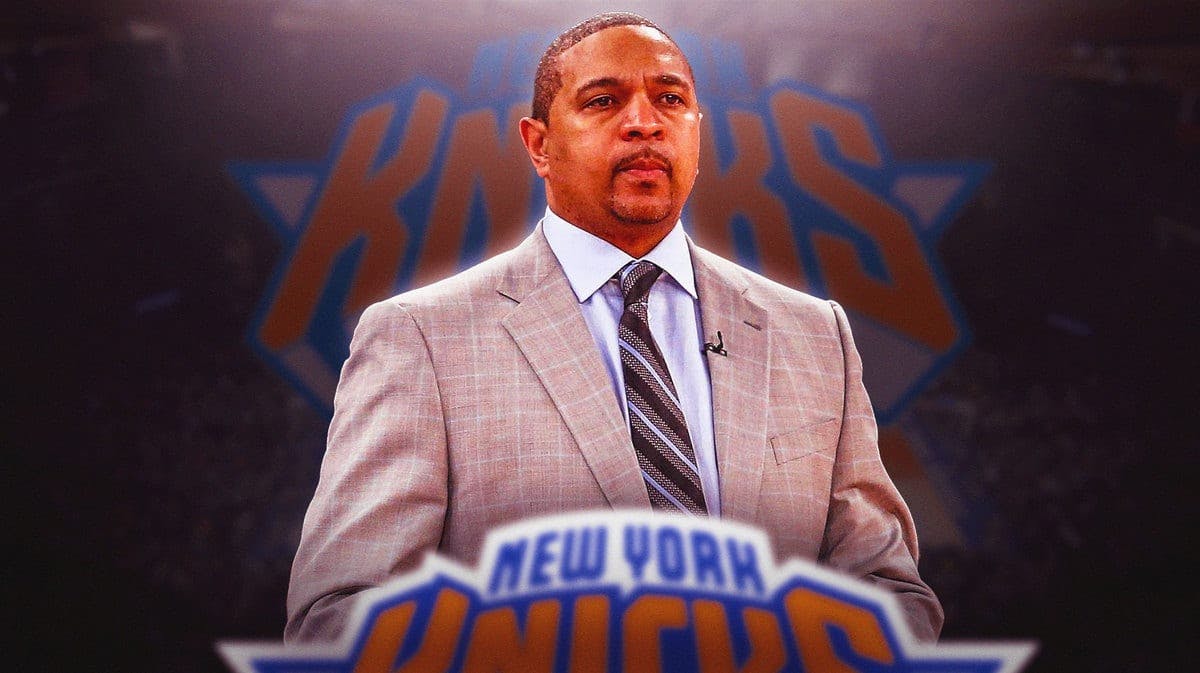 New York Knicks legend Mark Jackson in front of the logo in Madison Square Garden.