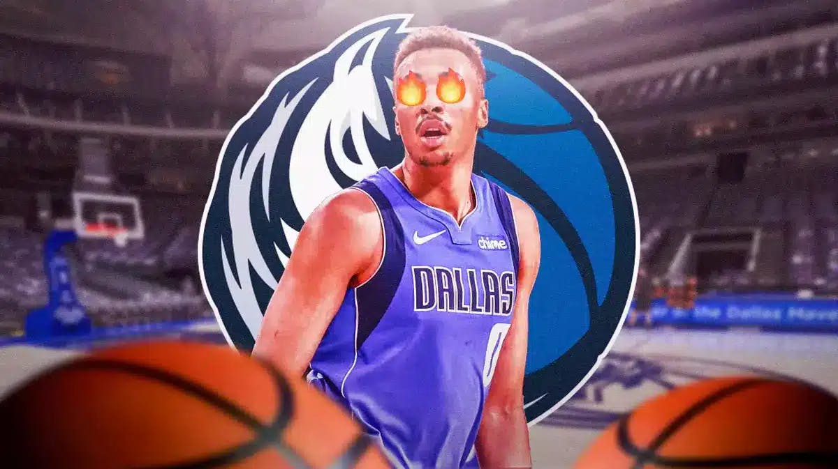 Mavs' Dante Exum in front with fire in eyes. Mavs' logo in background.