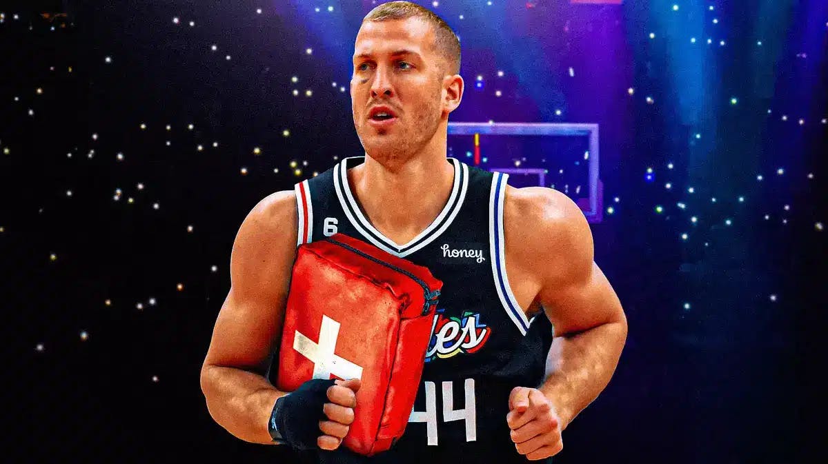 ACTION SHOT of Mason Plumlee (Clippers) with the ball as medical cross symbol