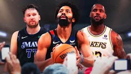 Lakers' LeBron James looking at Spencer Dinwiddie and Luka Doncic also looking.
