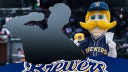 Silhouete of action shot of pitcher Jakob Junis (Giants) with Brewers mascot and logo in the background