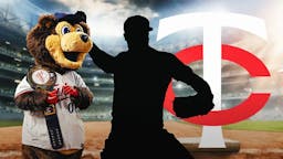 silhouette of an action shot of Jay Jackson (pitcher) with Minnesota Twins logo and Twins mascot in the background