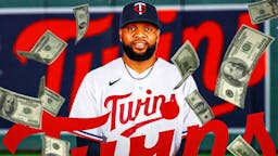 Carlos Santana in a Minnesota Twins jersey with a bunch of money falling around him