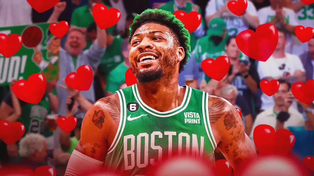 Marcus Smart smiling. Celtics fans in the background. Hearts all around