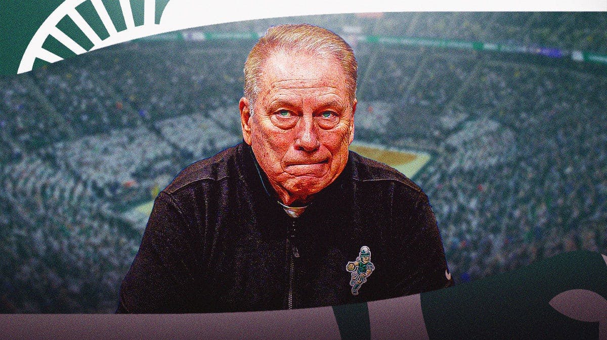 Tom Izzo, looking determined, Michigan logo in the background.