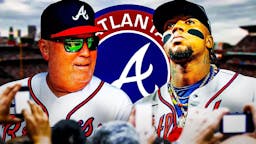 Brian Snitker and Ronald Acuna Jr in front of a Braves logo at Truist Park