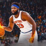 Mitchell Robinson with his hands on fire