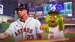 Michael Brantley (Astros) with deal with it shades and with Astros mascot in the background.