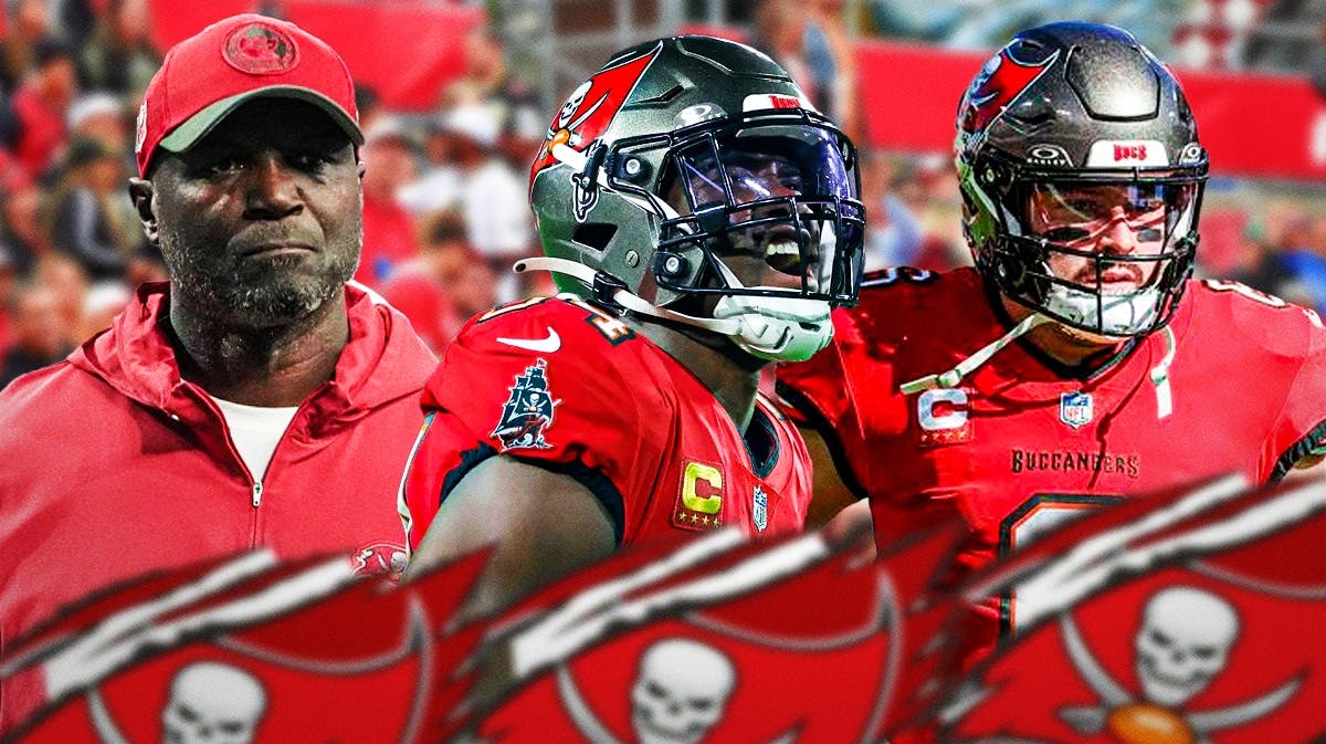 Coach Todd Bowles in the middle, Lavonte David and Baker Mayfield around him, and Tampa Bay Buccaneers wallpaper in the background.