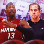 Miami Heat stars Bam Adebayo, Tyler Herro, Caleb Martin, and head coach Erik Spoelstra in front of the fans of the Kaseya Center.