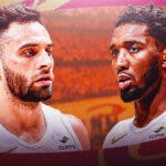 Cavs' Donovan Mitchell and Max Struss look at Magic crowd during NBA Playoffs,