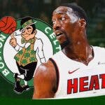 Heat's Bam Adebayo stands next to Celtics logo during NBA Playoffs