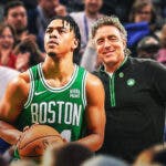 Wyc Grousbeck and Jaden Springer (Celtics jersey) both looking happy amidst a crowd of angry Philadelphia 76ers fans