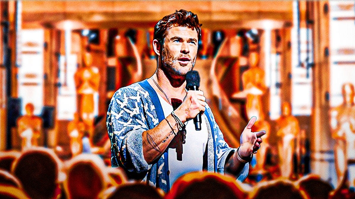 Chris Hemsworth with a microphone.