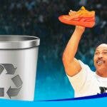 Lavar Ball holding Lamelo's MB02 and shooting it in the trash.