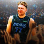 Mavericks' Luka Doncic smiling at the American Airlines Center. In background, need Mavericks fans cheering at the American Airlines Center.