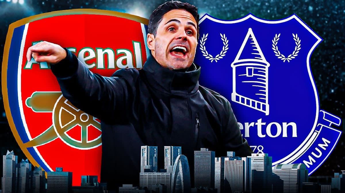 Mikel Arteta shouting in front of the Arsenal and Everton logos