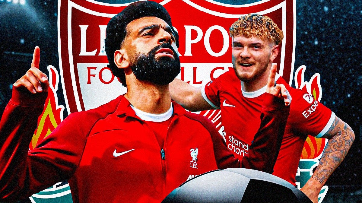 Mohamed Salah, Harvey Elliot celebrating in front of the Liverpool logo