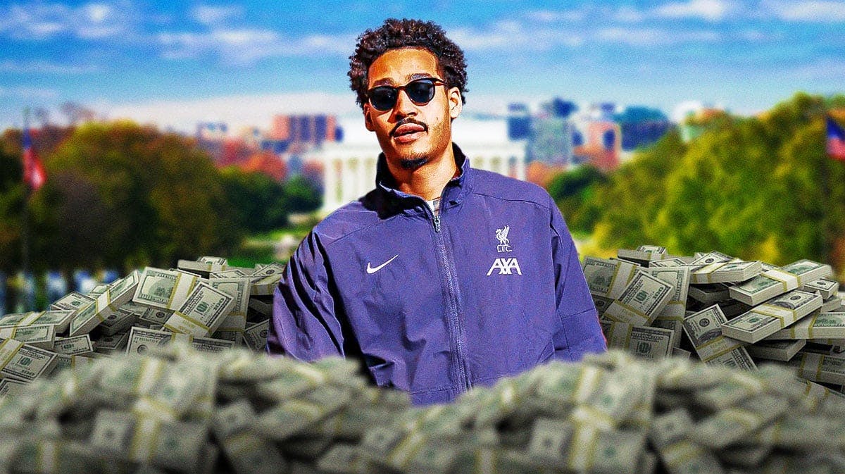 Jordan Poole surrounded by piles of cash.