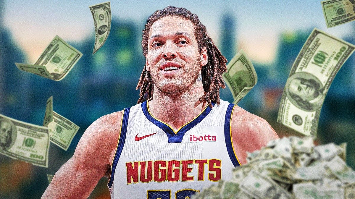 Aaron Gordon surrounded by piles of cash.