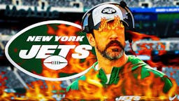 Jets Aaron Rodgers with fire in his eyes and surrounded by fire