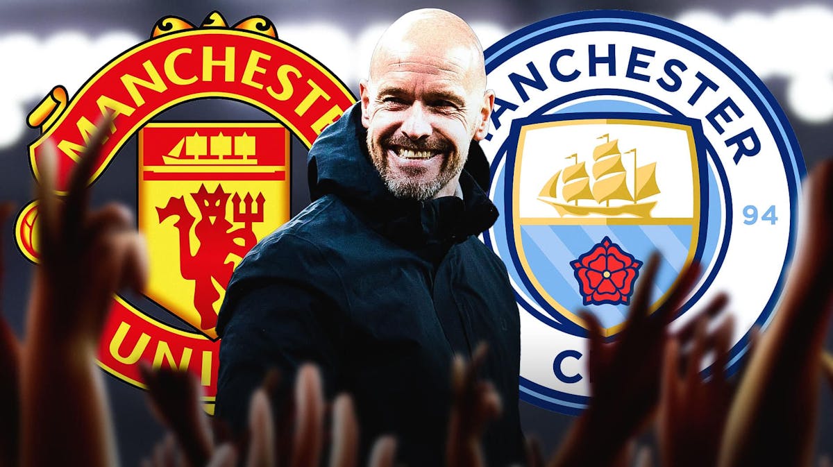 Erik ten hag smiling in front of the Manchester United and manchester City logos