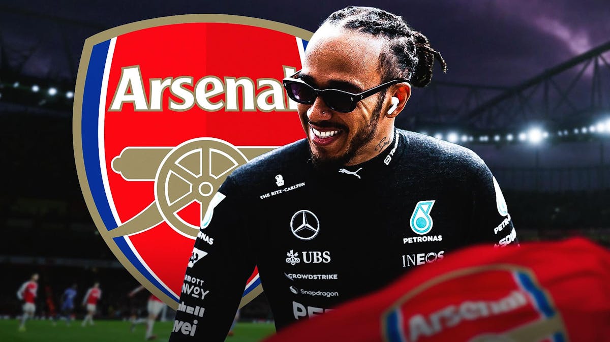 Lewis Hamilton laughing in front of the Arsenal logo