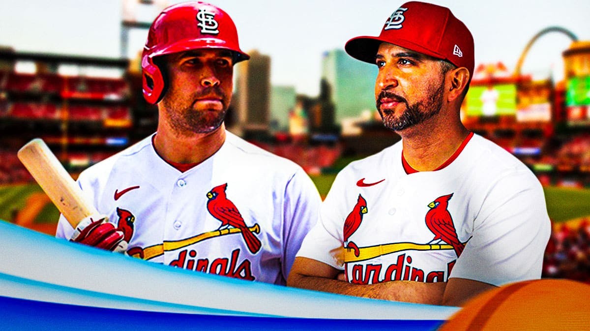 St. Louis Cardinals outfielder Dylan Carlson next to manager Oliver Marmol