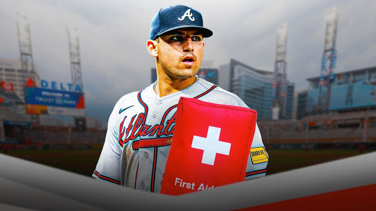 Atlanta Braves infielder Austin Riley with a medical bag on him.