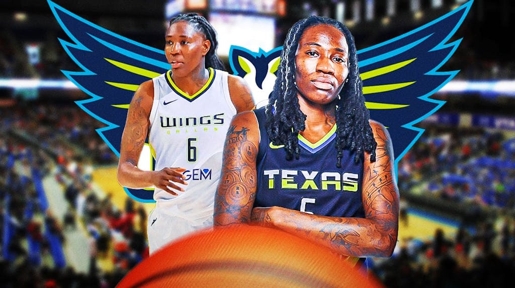Natasha Howard (Dallas Wings) looking serious with the Dallas Wings' logo in background.