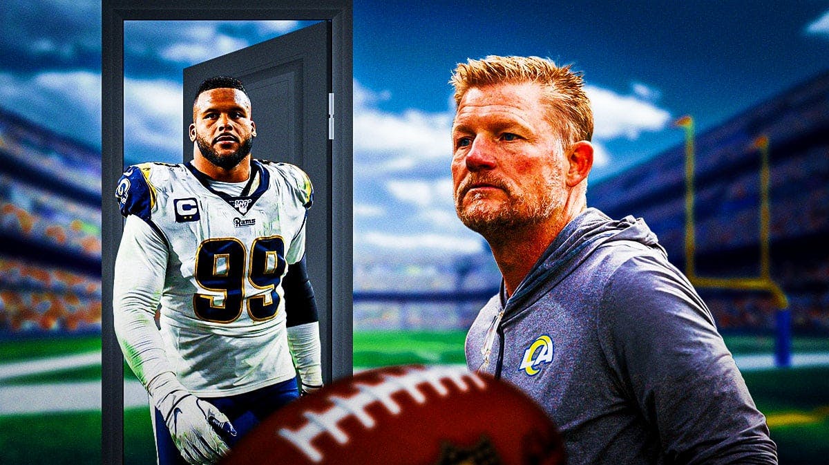 Los Angeles Rams general manager Les Snead with Aaron Donald walking through a door