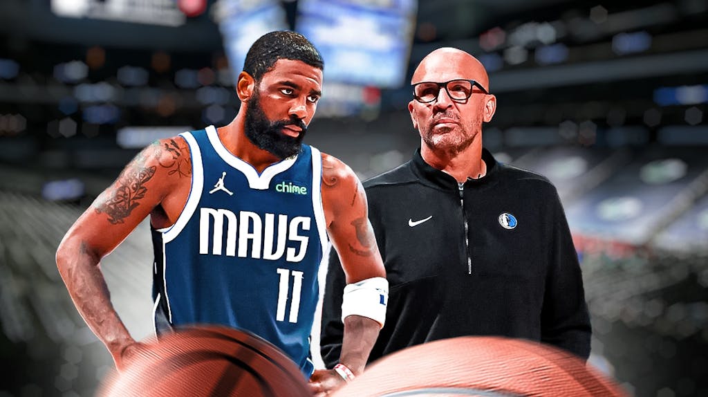 Mavericks' Kyrie Irving and Mavericks' Jason Kidd both standing next to each other looking serious in the American Airlines Center.