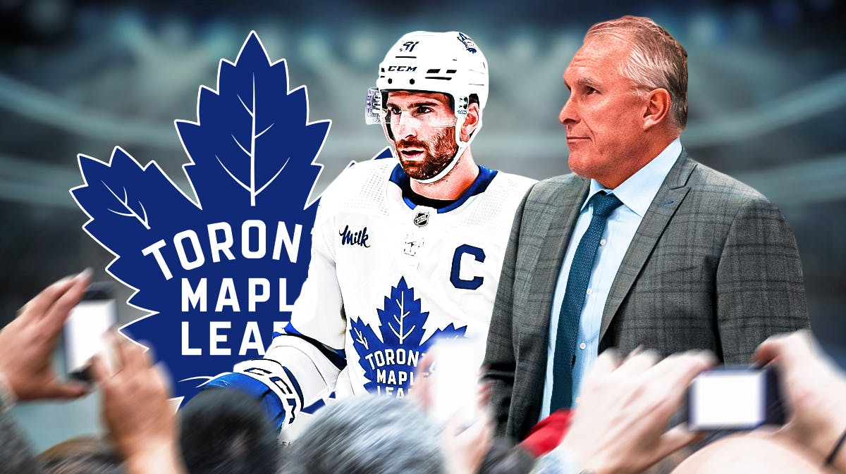 Toronto Maple Leafs forward John Tavares with new head coach Craig Berube. They are next to a logo for the Toronto Maple Leafs.