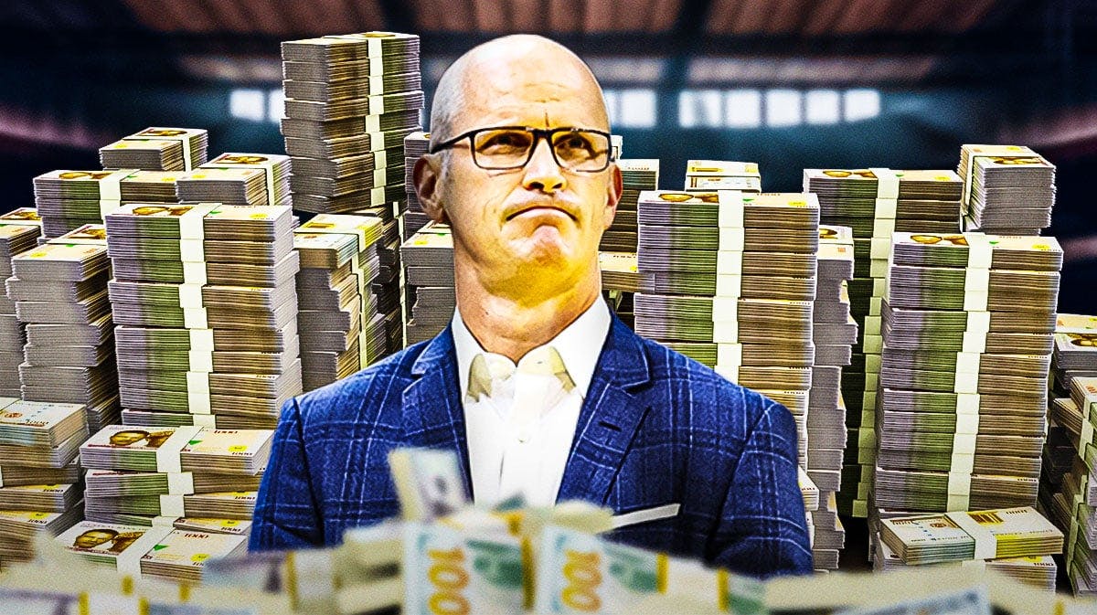 Dan Hurley surrounded by piles of cash.