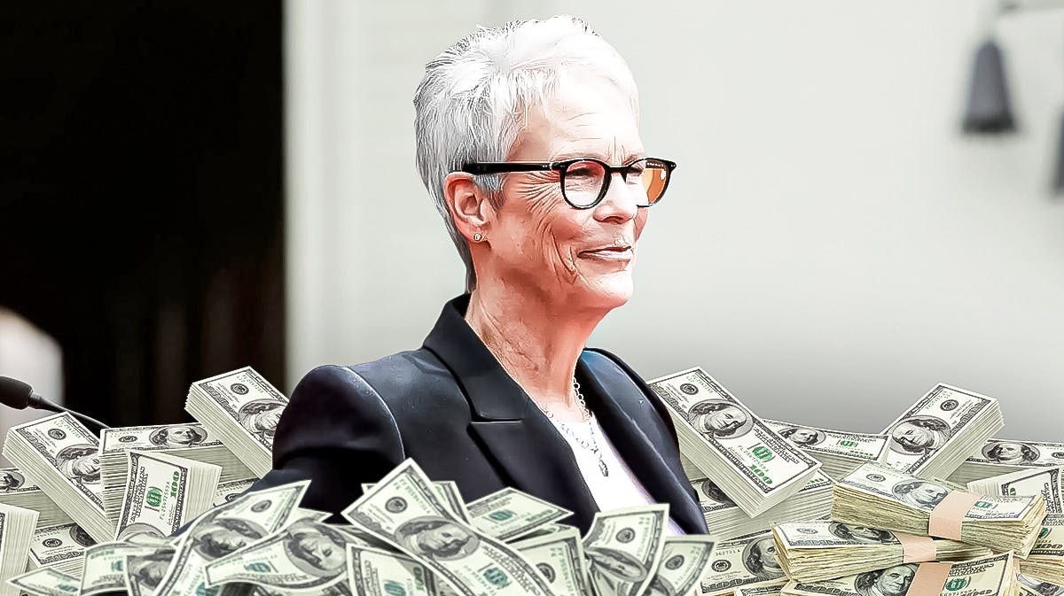 Jamie Lee Curtis surrounded by piles of cash.
