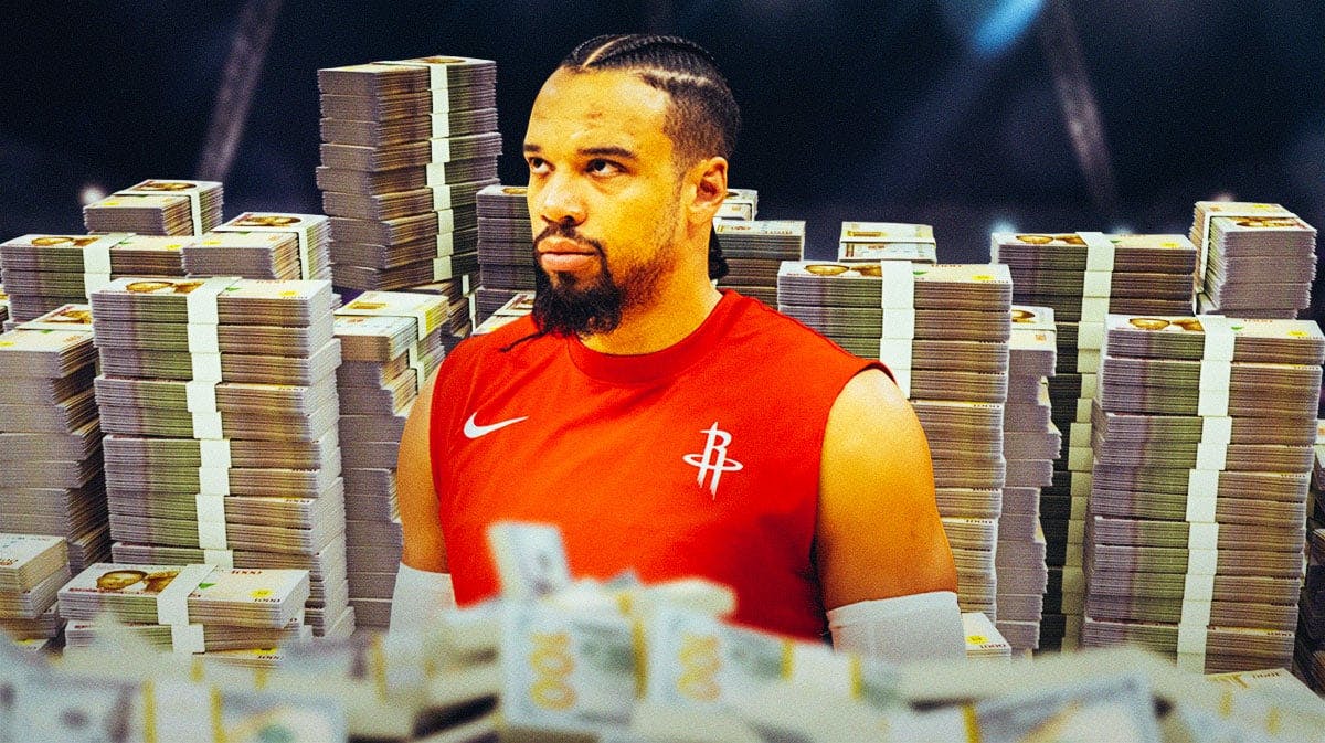 Dillon Brooks surrounded by piles of cash.