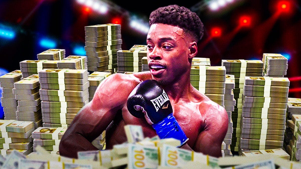Errol Spence Jr. surrounded by piles of cash.