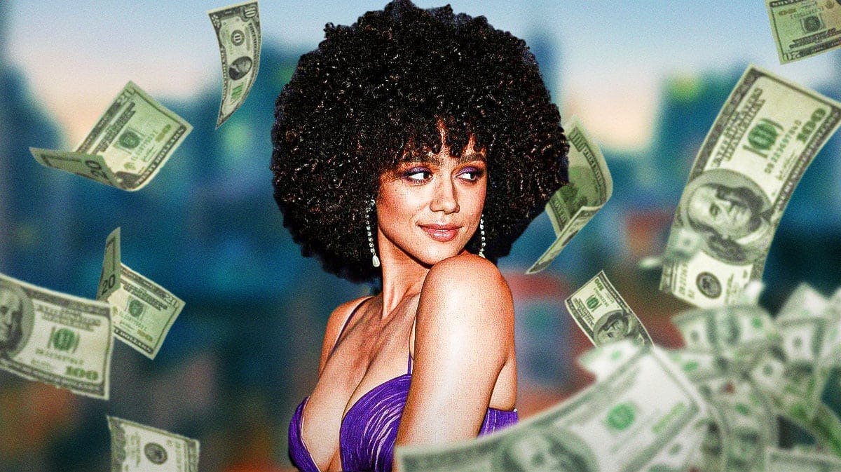 Nathalie Emmanuel surrounded by piles of cash.