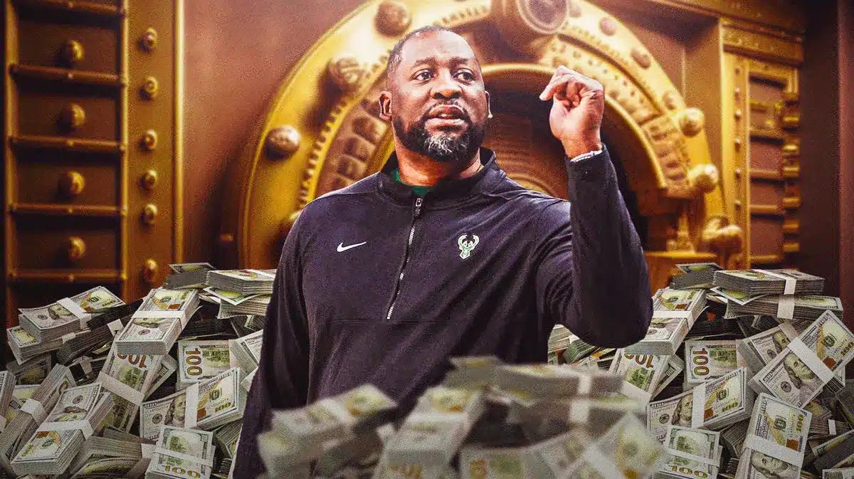 Adrian Griffin surrounded by piles of cash.