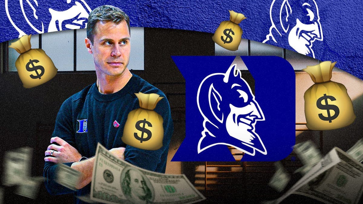 Duke's Jon Scheyer with all the money from his extension. Background is Cameron Indoor